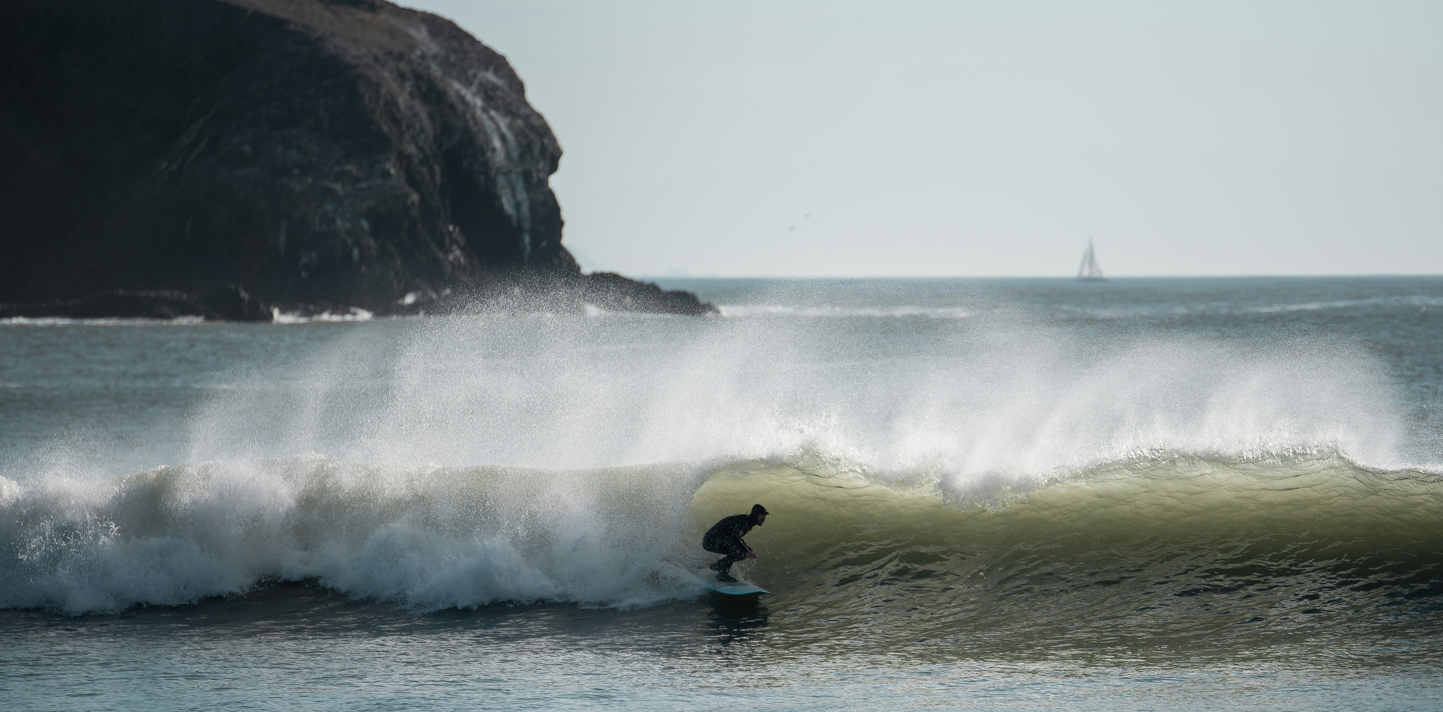 person riding surf board in ocean